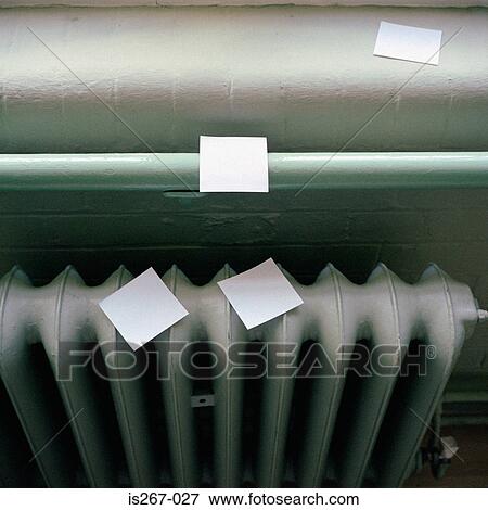 Stock Photo - Adhesive notes on radiator. Fotosearch