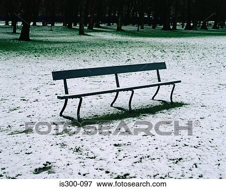 Bench in a snowy park View Large Photo Image Stock Photo - Bench in a snowy park. Fotosearch