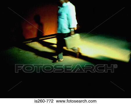 Blurred person carrying briefcase View Large Photo Image Stock Image - Blurred person carrying briefcase. Fotosearch