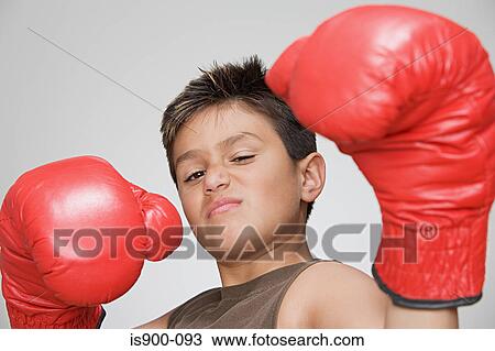 Boy wearing boxing gloves View Large Photo Image Stock Image - Boy wearing boxing gloves. Fotosearch
