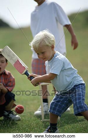 Boys playing cricket View Large Photo Image Stock Photograph - Boys playing cricket. Fotosearch