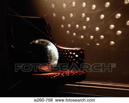 Disco ball on leather armchair View Large Photo Image Stock Photo - Disco ball on leather armchair. Fotosearch