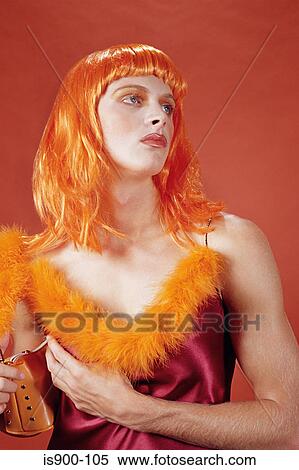 Drag queen wearing an orange outfit View Large Photo Image Stock Photography - Drag queen wearing an orange outfit. Fotosearch