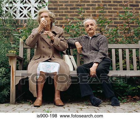 Elderly couple on a bench View Large Photo Image Stock Photo - Elderly couple on a bench. Fotosearch