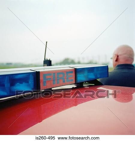 Stock Photography - Fireman near automobile. Fotosearch