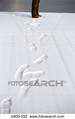 Stock Image - Footprints in snow. Fotosearch