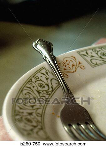 Stock Image - Fork on dinner plate. Fotosearch
