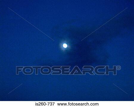 Full moon in cloudy sky View Large Photo Image Stock Photo - Full moon in cloudy sky. Fotosearch