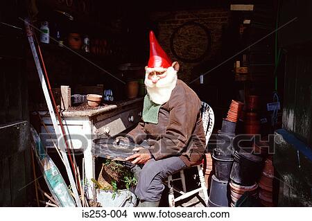 Garden gnome with gardening materials View Large Photo Image Picture - Garden gnome with gardening materials. Fotosearch