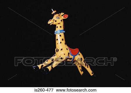 Giraffe toy ride for children View Large Photo Image Stock Photo - Giraffe toy ride for children. Fotosearch