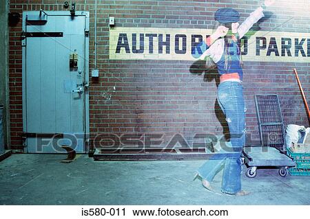 Girl dancing at back of building View Large Photo Image Stock Image - Girl dancing at back of building. Fotosearch