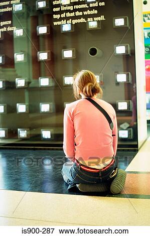 Girl kneeling in art gallery View Large Photo Image Stock Photo - Girl kneeling in art gallery. Fotosearch