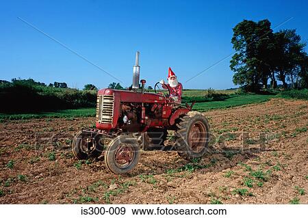 Stock Photo - Gnome on a tractor. Fotosearch