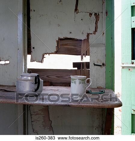 Kettle and cup on shelf View Large Photo Image Stock Image - Kettle and cup on shelf. Fotosearch