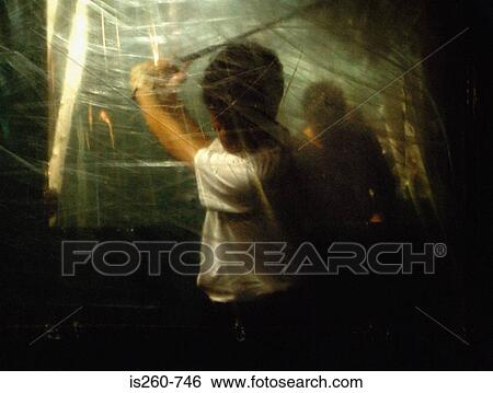 Man cutting through cobwebs View Large Photo Image Stock Photograph - Man cutting through cobwebs. Fotosearch