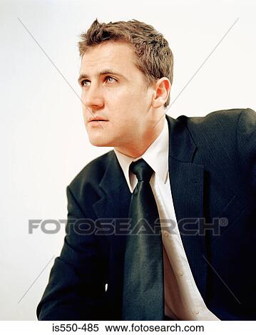 Man in suit poses theatrically View Large Photo Image Stock Photography - Man in suit poses theatrically. Fotosearch