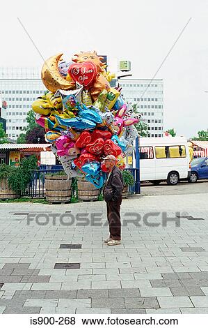 Man selling balloons View Large Photo Image Stock Photo - Man selling balloons. Fotosearch