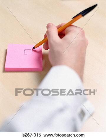 Man writing on square pad View Large Photo Image Stock Photography - Man writing on square pad. Fotosearch