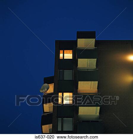 Stock Image - Outside an apartment block at night. Fotosearch