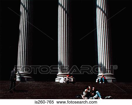 Stock Photography - People sitting near columns. Fotosearch