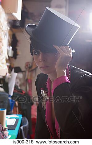 Performer adjusting her top hat View Large Photo Image Stock Photo - Performer adjusting her top hat. Fotosearch