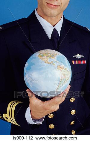 Pilot holding a globe View Large Photo Image Stock Image - Pilot holding a globe. Fotosearch