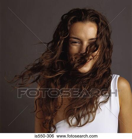 Stock Photograph - Portrait of smiling woman. Fotosearch