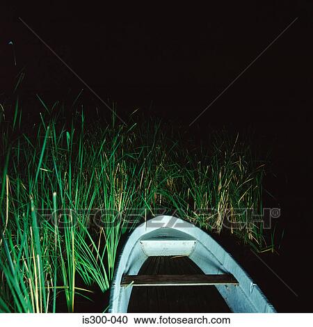Rowboat in river bank View Large Photo Image Stock Image - Rowboat in river bank. Fotosearch