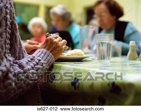 Seniors having dinner View Large Photo Image Stock Image - Seniors having dinner. Fotosearch