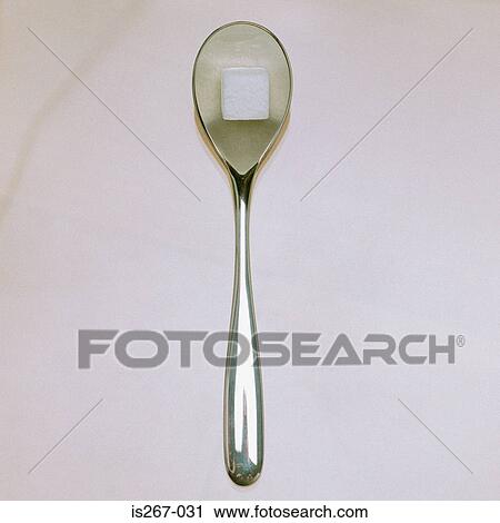 Stock Image - Sugarcube on spoon. Fotosearch