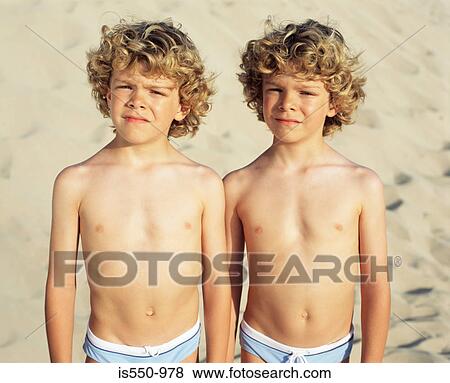 Stock Photo - Twin boys at the beach. Fotosearch