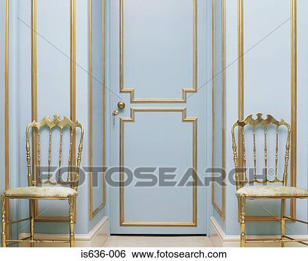 Two gold chairs in an empty room View Large Photo Image Stock Photograph - Two gold chairs in an empty room. Fotosearch