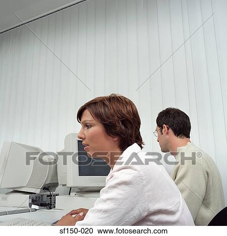 Two office workers View Large Photo Image Stock Image - Two office workers. Fotosearch