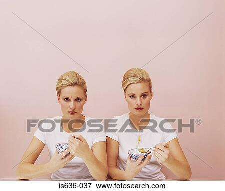 Stock Photo - Two women eating soup. Fotosearch