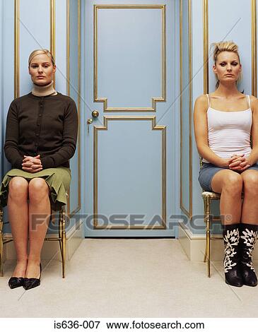 Two women on opposite sides of a doorway View Large Photo Image Stock Photo - Two women on opposite sides of a doorway . Fotosearch