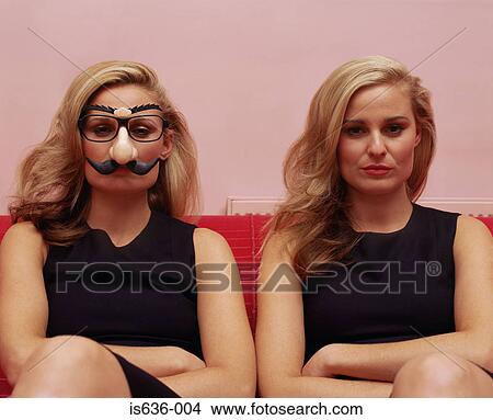 Two women one wearing a comedy disguise View Large Photo Image Picture - Two women one wearing a comedy disguise. Fotosearch