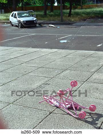 Vandalised car and pram View Large Photo Image Stock Photo - Vandalised car and pram. Fotosearch