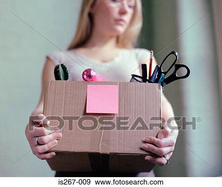 Woman carrying box of stationery View Large Photo Image Stock Photo - Woman carrying box of stationery. Fotosearch