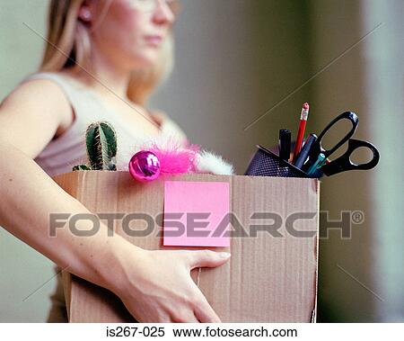 Woman carrying box of stationery View Large Photo Image Stock Photography - Woman carrying box of stationery. Fotosearch