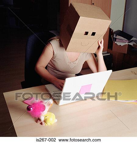 Woman wearing a cardboard box View Large Photo Image Stock Image - Woman wearing a cardboard box. Fotosearch