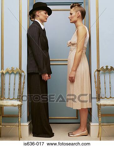 Women in masculine and feminine clothing View Large Photo Image Stock Photo - Women in masculine and feminine clothing. Fotosearch
