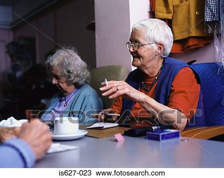 Women smoking and playing bingo View Large Photo Image Stock Image - Women smoking and playing bingo. Fotosearch