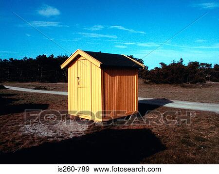 Stock Photo - Yellow shed in field. Fotosearch