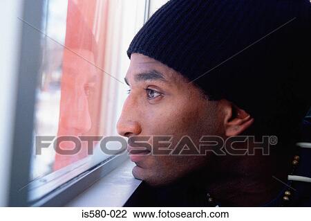 Young man daydreaming View Large Photo Image Stock Image - Young man daydreaming. Fotosearch