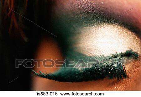 Stock Photograph - Cosmetics on male eye. Fotosearch