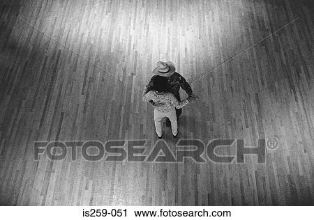 Couple dancing on wooden floor View Large Photo Image Stock Image - Couple dancing on wooden floor. Fotosearch
