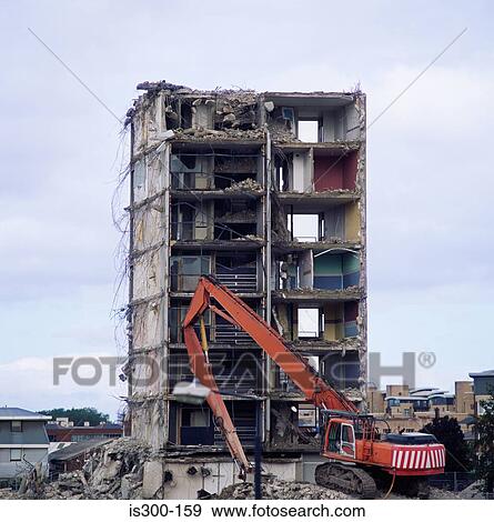 Crane demolishing a building View Large Photo Image Stock Photo - Crane demolishing a building. Fotosearch