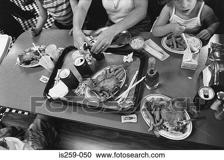 Family having junk food meal View Large Photo Image Stock Image - Family having junk food meal. Fotosearch