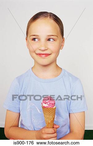 Stock Photograph - Girl holding an ice cream. Fotosearch