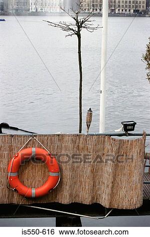 Stock Photograph - Life preserver near river. Fotosearch
